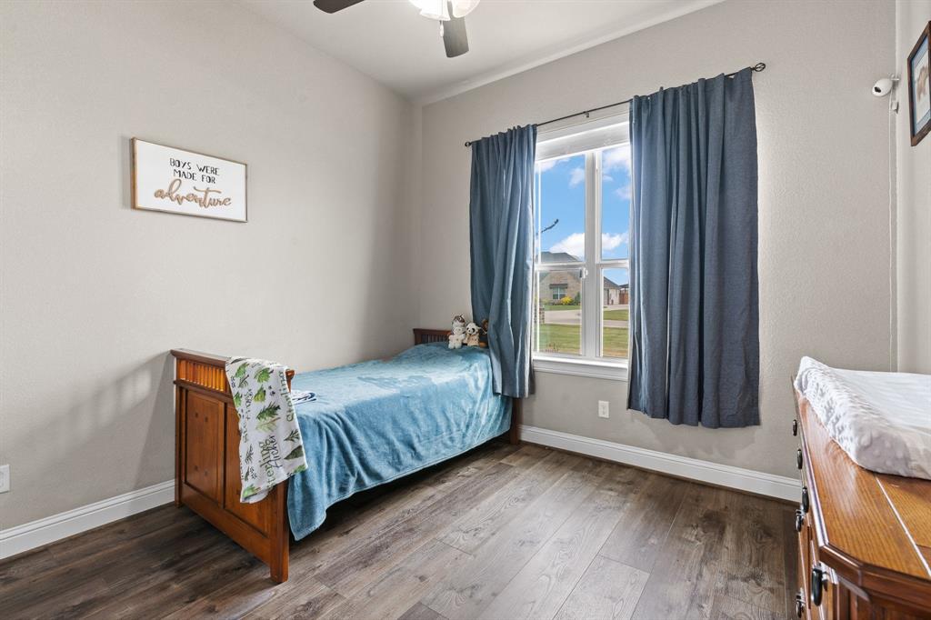 9708 Puma Trail Godley, TX 76044 - Photo 20 of 40 a bedroom with a bed and window