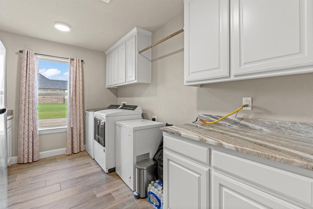 9708 Puma Trail Godley, TX 76044 - Photo 27 of 40 a view of a kitchen with sink and cabinets