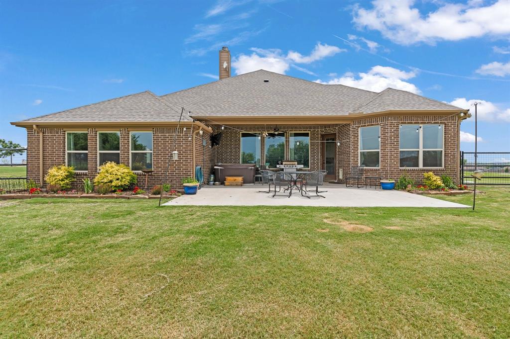 9708 Puma Trail Godley, TX 76044 - Photo 31 of 40 a front view of a house with swimming pool having outdoor seating