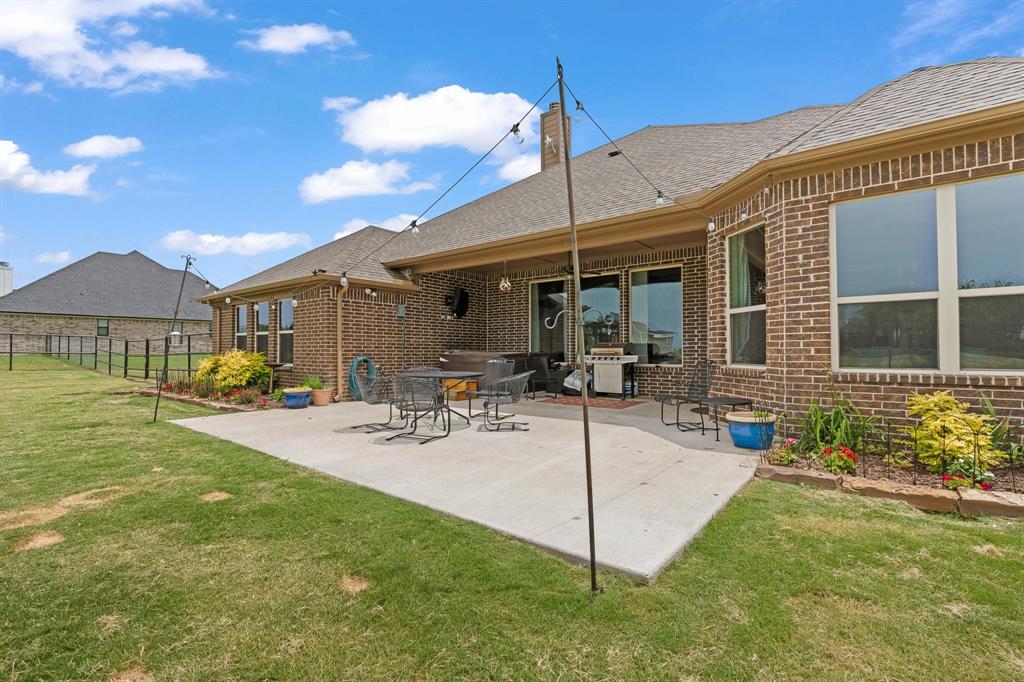 9708 Puma Trail Godley, TX 76044 - Photo 32 of 40 a view of a house with a patio