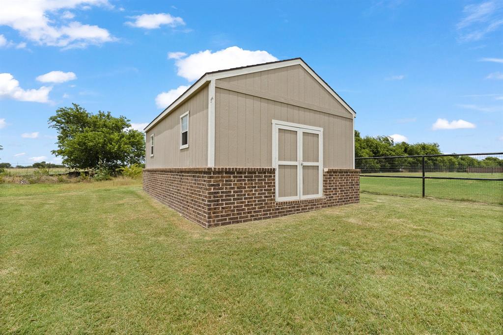 9708 Puma Trail Godley, TX 76044 - Photo 36 of 40 a view of a house with a yard