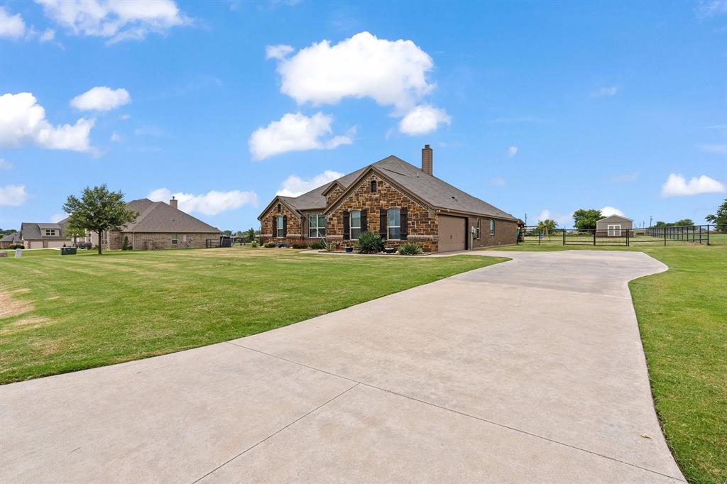 9708 Puma Trail Godley, TX 76044 - Photo 38 of 40 a view of a house with a yard and entertaining space