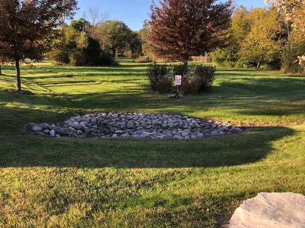 a view of a golf course with a lake