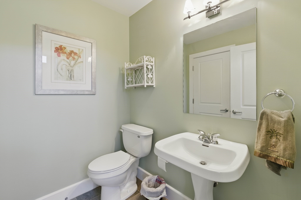 2 Powder Mill Square, Unit 2B Andover, MA 01810 - Photo 12 of 31 a bathroom with a toilet sink and mirror