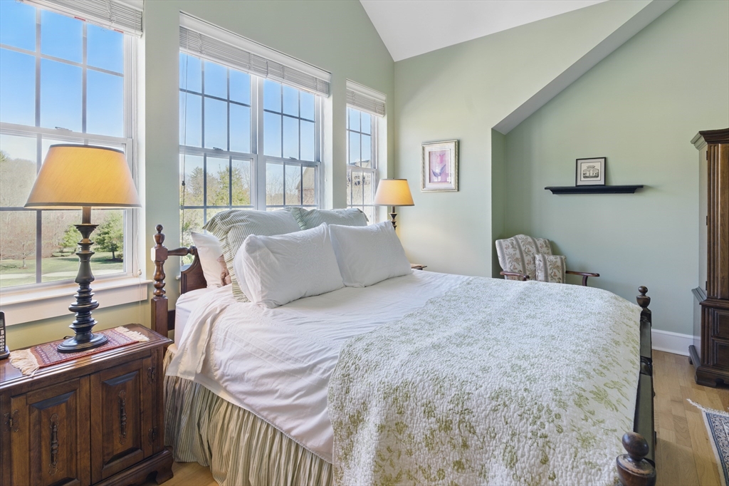 2 Powder Mill Square, Unit 2B Andover, MA 01810 - Photo 19 of 31 a bedroom with a bed and a window