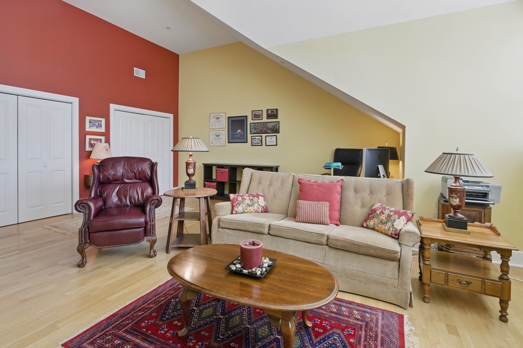 2 Powder Mill Square, Unit 2B Andover, MA 01810 - Photo 24 of 31 a living room with furniture and a couch