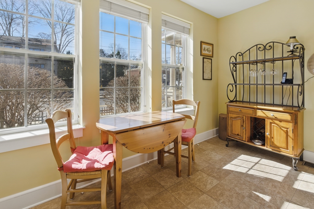 2 Powder Mill Square, Unit 2B Andover, MA 01810 - Photo 6 of 31 a view of a dining room with furniture window and outside view