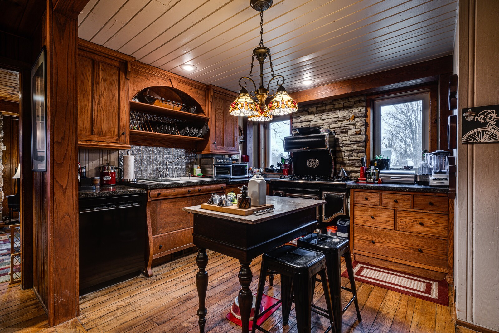 1495 Deep Draw Road Crossville, TN 38555 - Photo 5 of 41 a kitchen with stainless steel appliances granite countertop a stove top oven a refrigerator a sink and dishwasher with wooden floor
