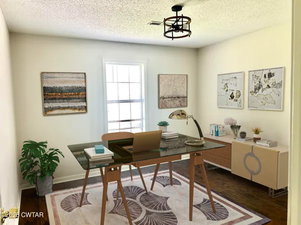 a workspace with furniture and window