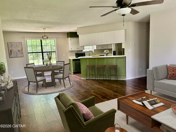 a living room with furniture and a window