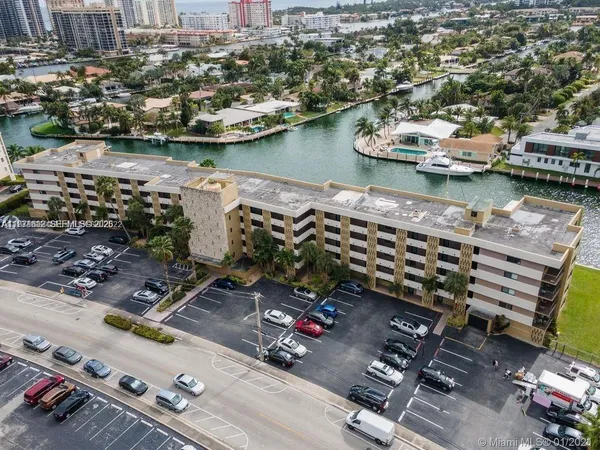 an aerial view of a house with a lake view