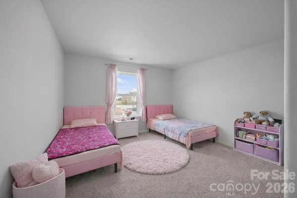 a bedroom with furniture and a couch