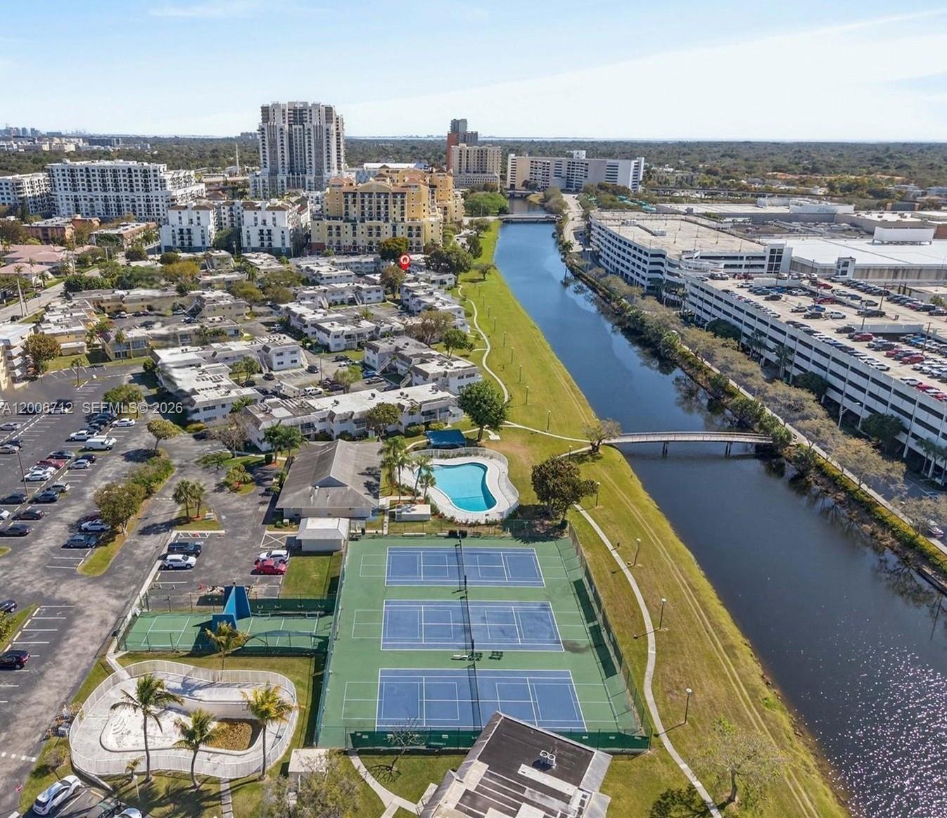 7344 Southwest 82nd Street, Unit C114 Miami, FL 33143 - Photo 30 of 30 an aerial view of a city with lawn chairs