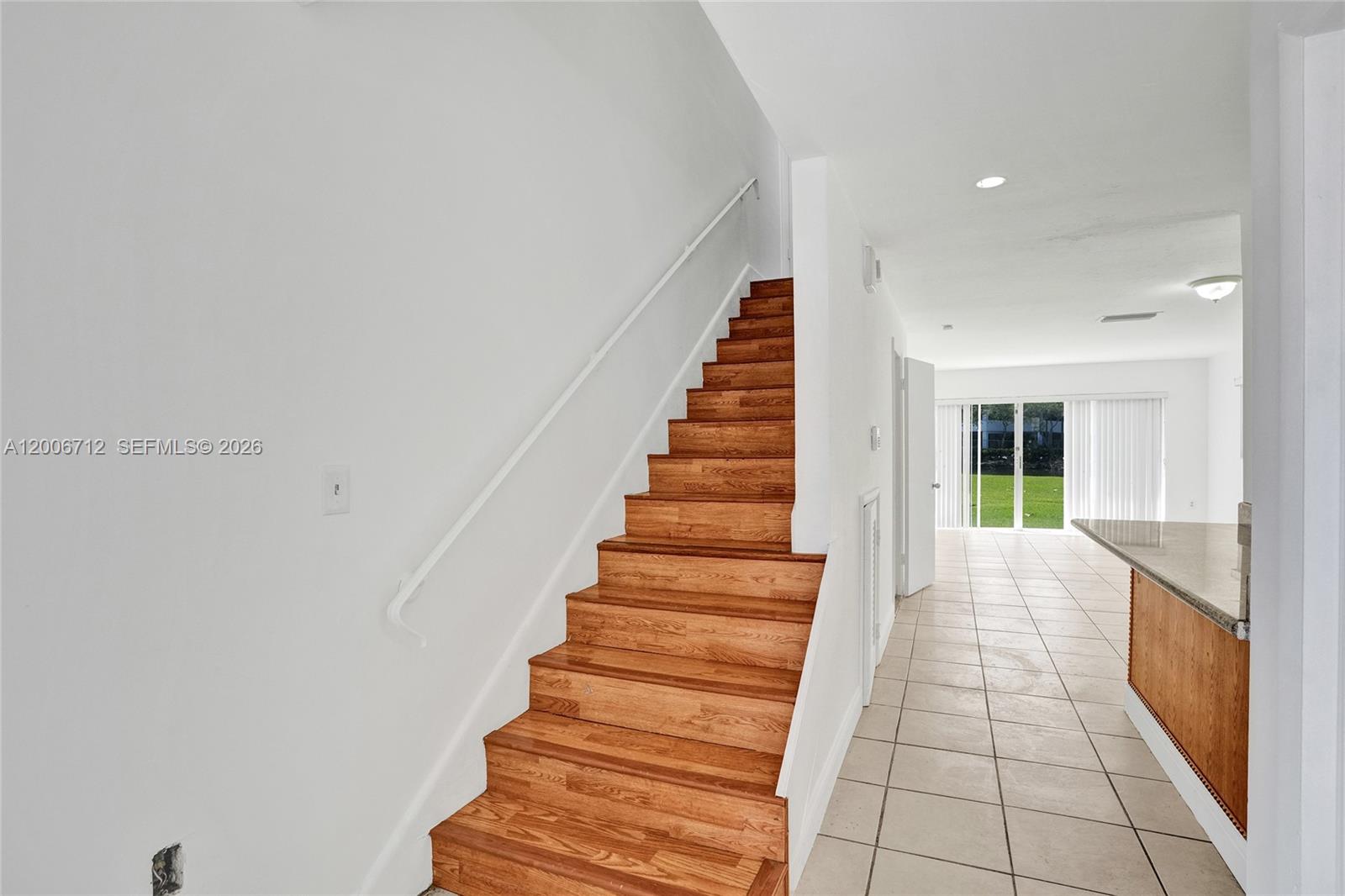 7344 Southwest 82nd Street, Unit C114 Miami, FL 33143 - Photo 5 of 30 a view of entryway with stairs