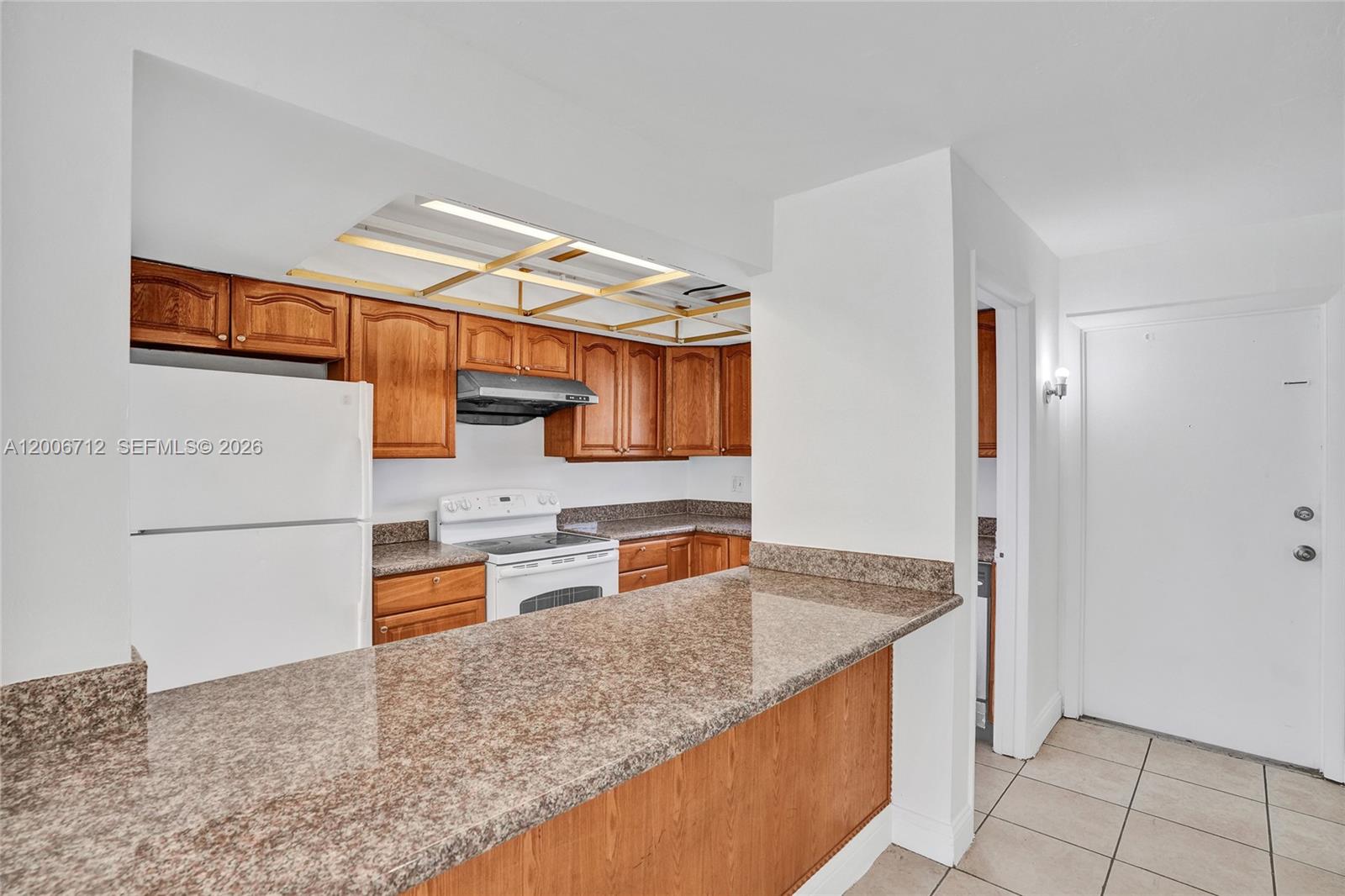 7344 Southwest 82nd Street, Unit C114 Miami, FL 33143 - Photo 6 of 30 a kitchen with stainless steel appliances granite countertop a sink stove and refrigerator