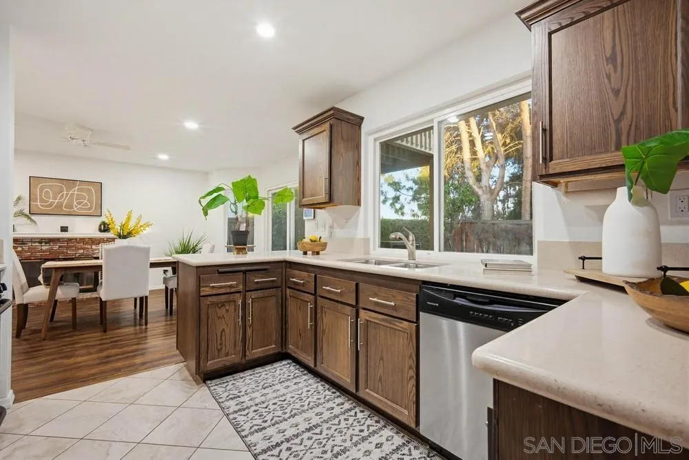39900 Quigley Road Murrieta, CA 92562 - Photo 13 of 58 a kitchen with a sink stove and cabinets