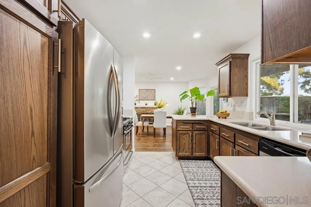 39900 Quigley Road Murrieta, CA 92562 - Photo 14 of 58 a open kitchen with stainless steel appliances granite countertop a refrigerator and a sink