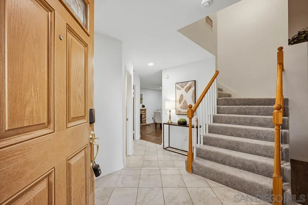 39900 Quigley Road Murrieta, CA 92562 - Photo 18 of 58 a view of entryway with wooden floor and stairs