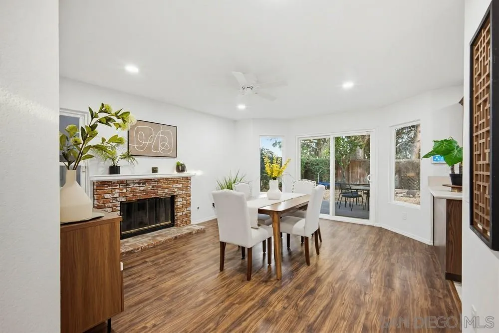 39900 Quigley Road Murrieta, CA 92562 - Photo 20 of 58 a dining room with furniture and a fireplace