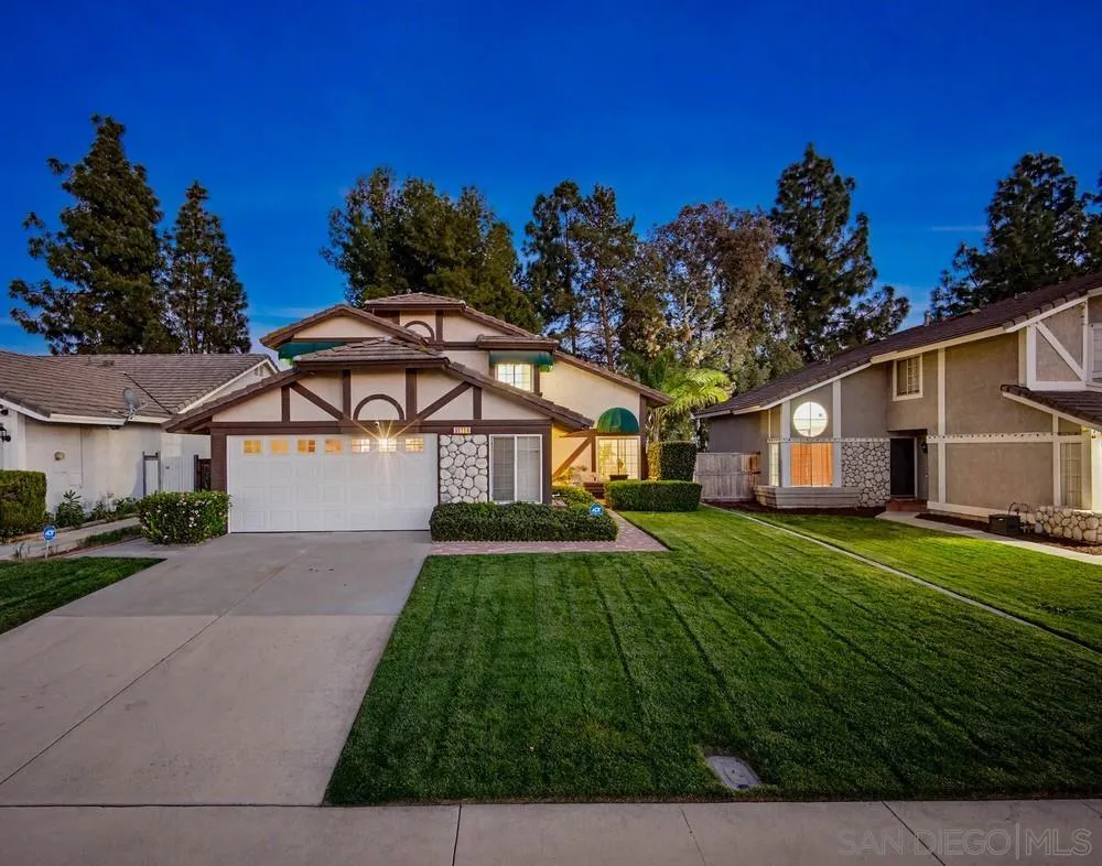 39900 Quigley Road Murrieta, CA 92562 - Photo 2 of 58 a front view of a house with a yard and garage