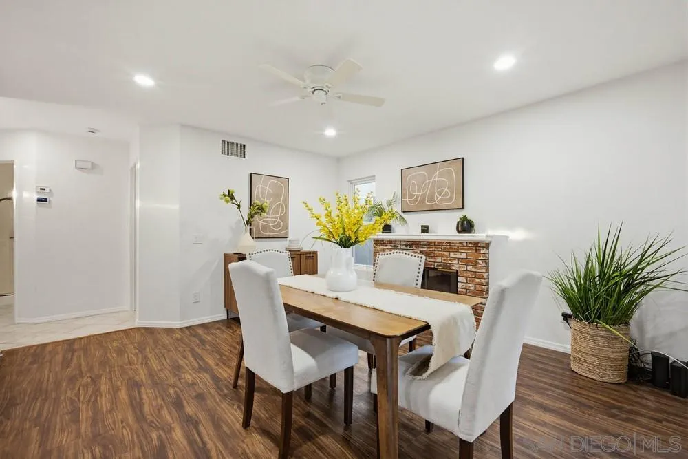 39900 Quigley Road Murrieta, CA 92562 - Photo 28 of 58 a view of a dining room with furniture and wooden floor