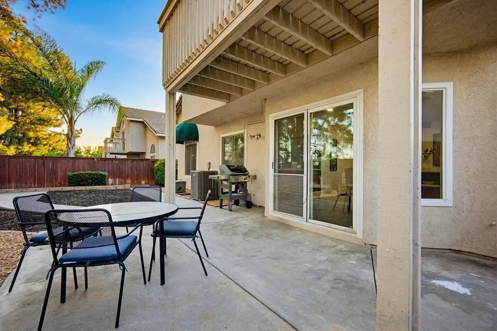 39900 Quigley Road Murrieta, CA 92562 - Photo 37 of 58 a view of a patio with a table and chairs and potted plants