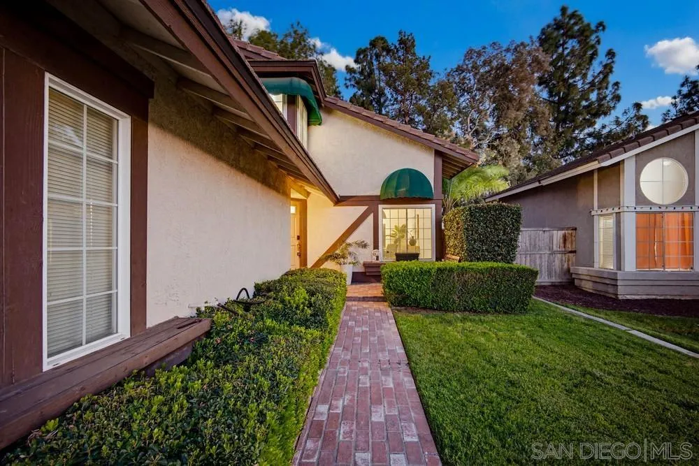 39900 Quigley Road Murrieta, CA 92562 - Photo 4 of 58 a view of a house with a backyard and a garden