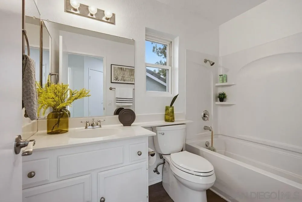 39900 Quigley Road Murrieta, CA 92562 - Photo 57 of 58 a bathroom with a sink a toilet and a mirror