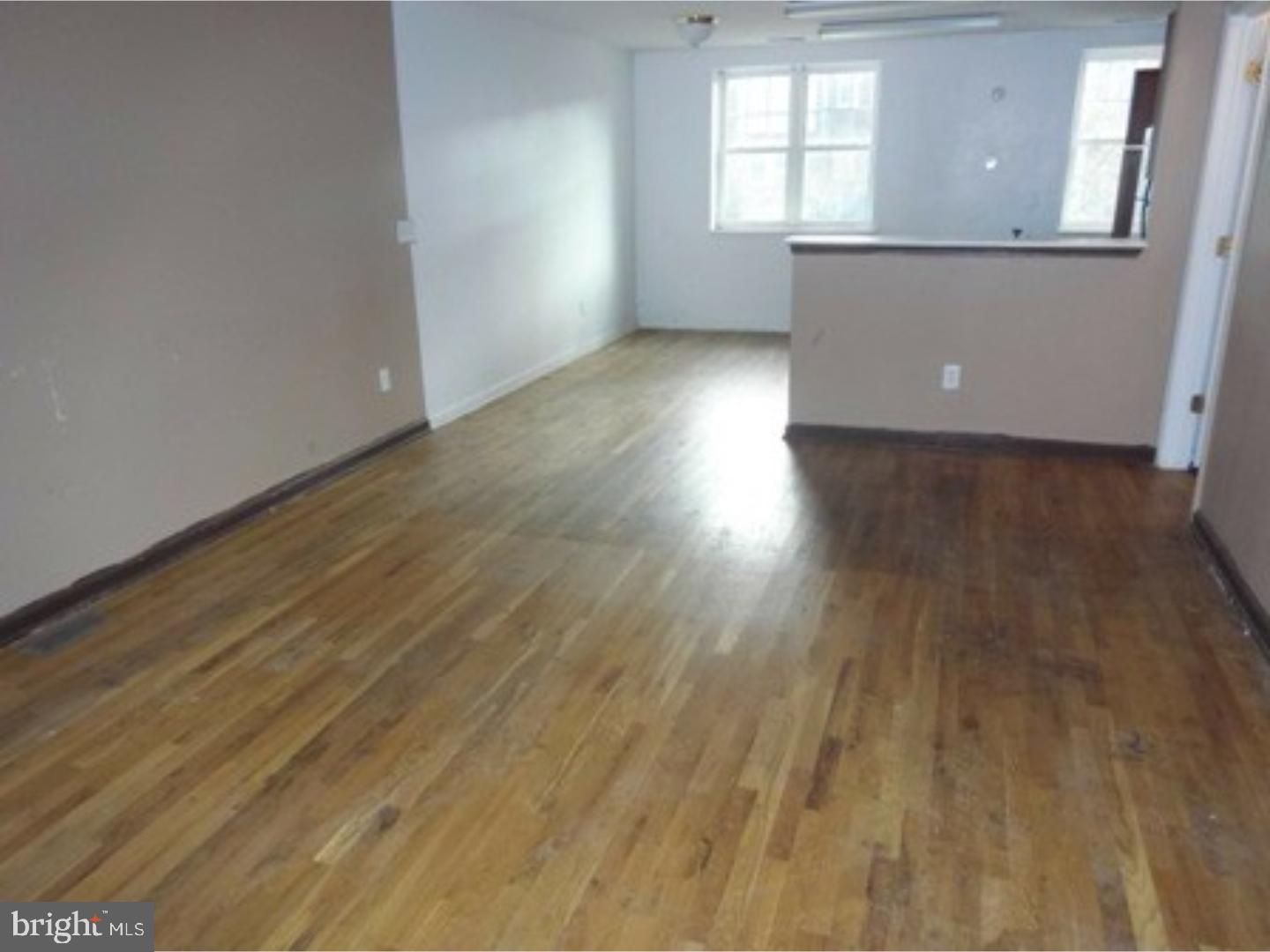 2891 Cushing Road Camden, NJ 08104 - Photo 3 of 3 wooden floor in an empty room with a window