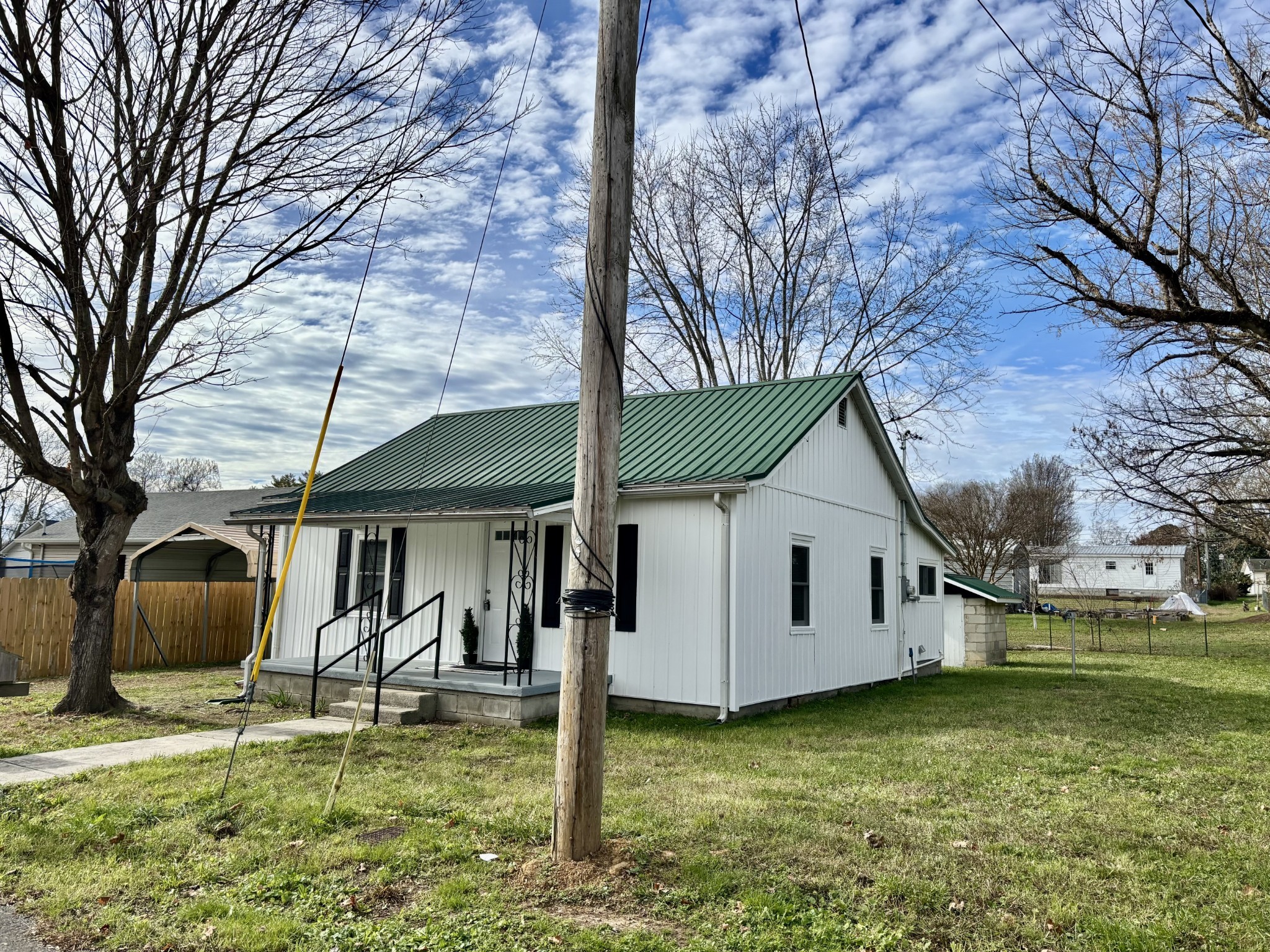 612 Maple Street Manchester, TN 37355 - Photo 3 of 20 a backyard of a house with barbeque oven