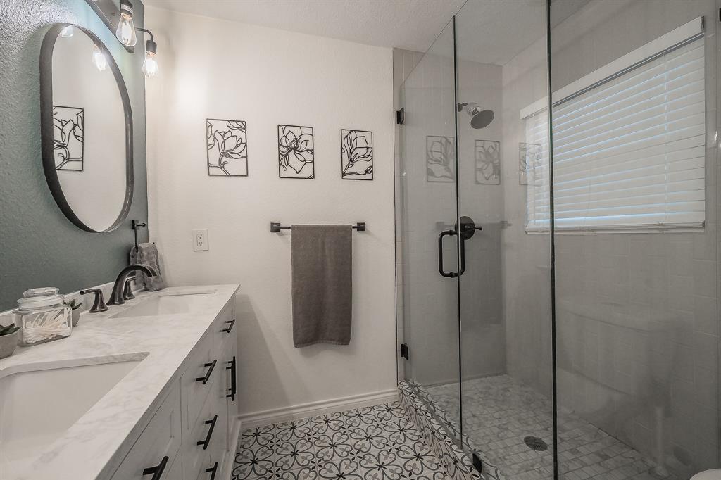 10866 Cassandra Way Dallas, TX 75228 - Photo 11 of 22 a bathroom with a double vanity sink mirror and shower