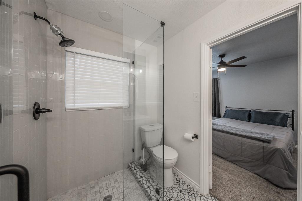 10866 Cassandra Way Dallas, TX 75228 - Photo 16 of 22 a bathroom with a sink toilet and shower