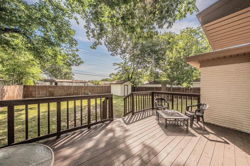 10866 Cassandra Way Dallas, TX 75228 - Photo 19 of 22 a view of balcony with wooden floor and outdoor seating
