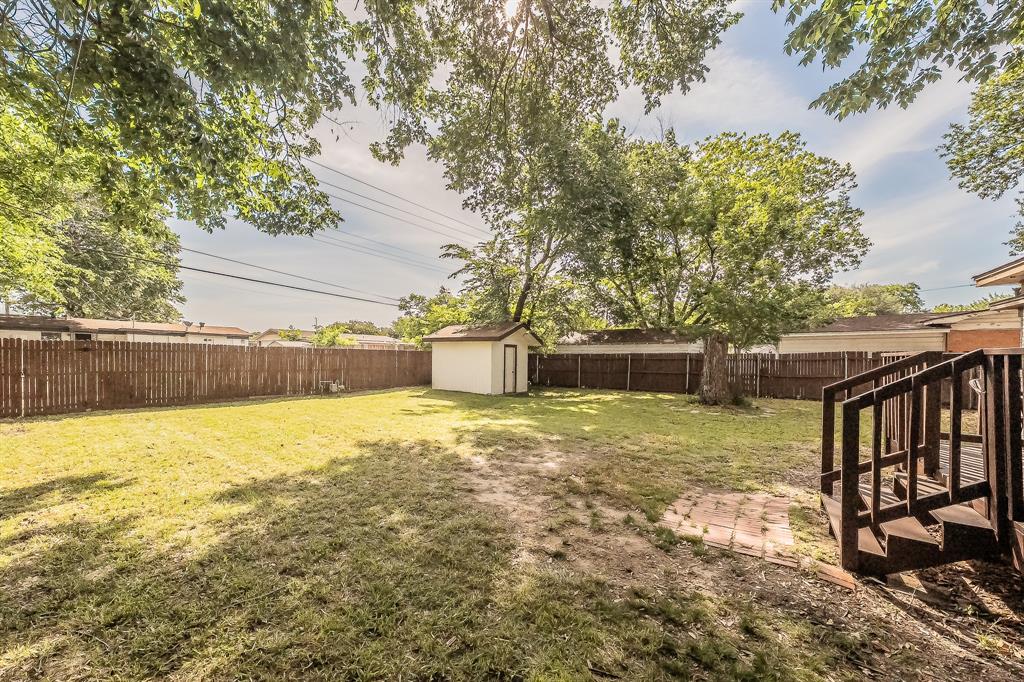 10866 Cassandra Way Dallas, TX 75228 - Photo 21 of 22 a view of a backyard