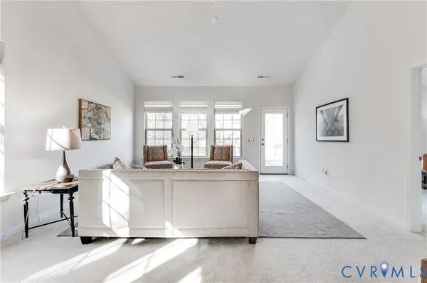 a kitchen with stainless steel appliances granite countertop a stove and white cabinets