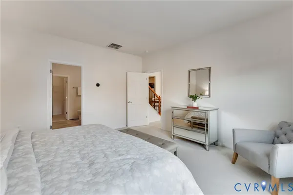 a bedroom with furniture and a window