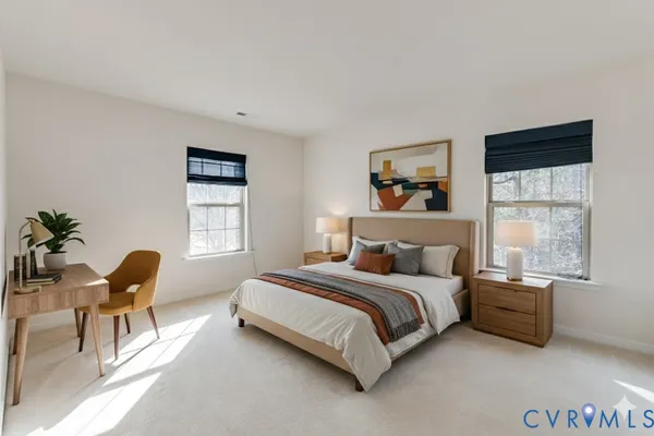 a bedroom with a bed and a chair