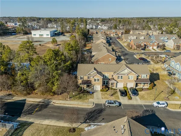 an aerial view of residential houses with outdoor space