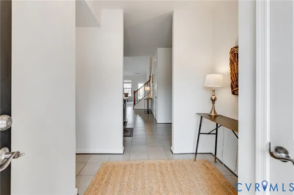 a view of hallway with wooden floor