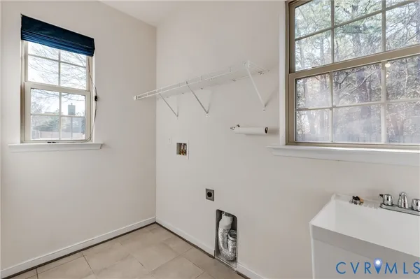 a bathroom with a sink and a window