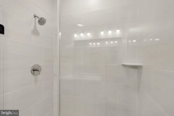 a view of an empty room with closet area