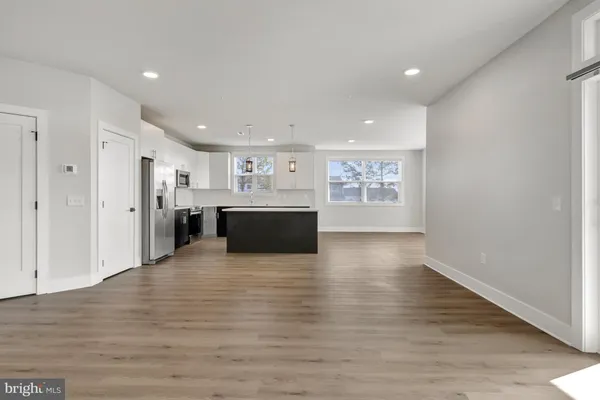 a view of kitchen with wooden floor