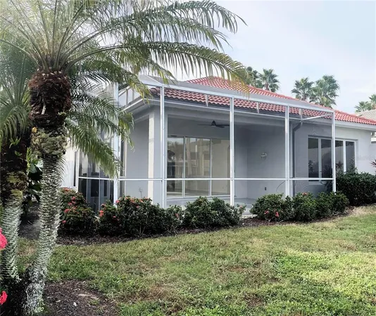 a view of a house with a yard and plants