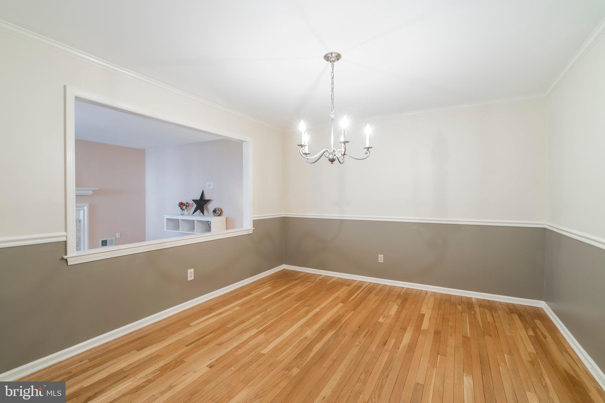 8 Foster Lane, Unit R8 Downingtown, PA 19335 - Photo 9 of 56 Dining room with chair rail and crown molding