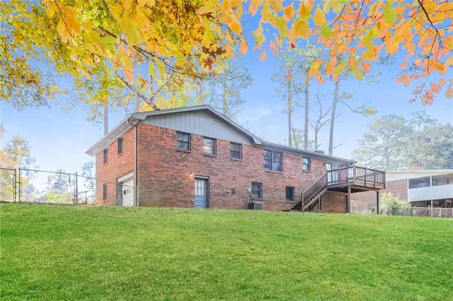 a view of a backyard with a large tree