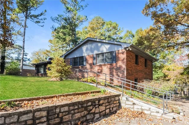 a front view of a house with garden