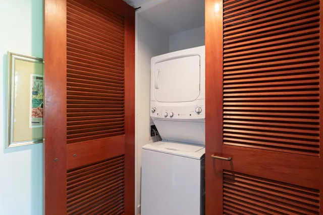 a view of kitchen and utility room with washer and dryer