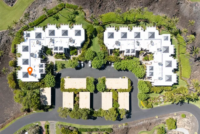 an aerial view of a house with a garden