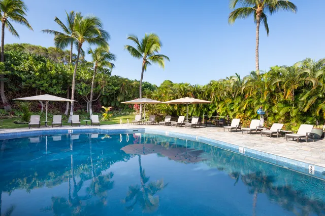 a view of swimming pool with a table and chairs