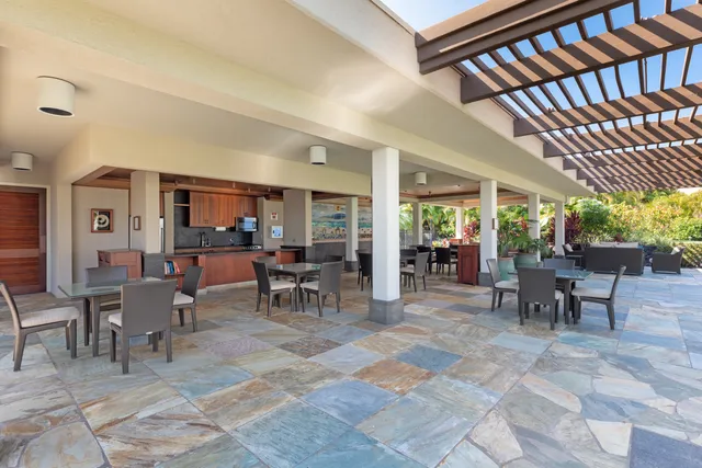 a view of a dining hall with lots of tables a window and chairs